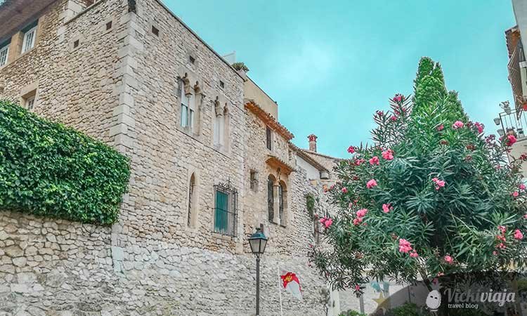 Casco Antiguo in Sitges, old building with plants surrounding it
