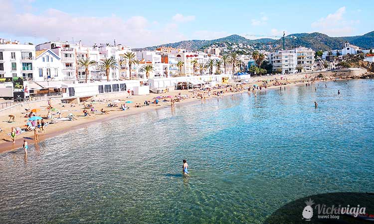 view of the beach of sitges, clear transparent water, city beach, from above