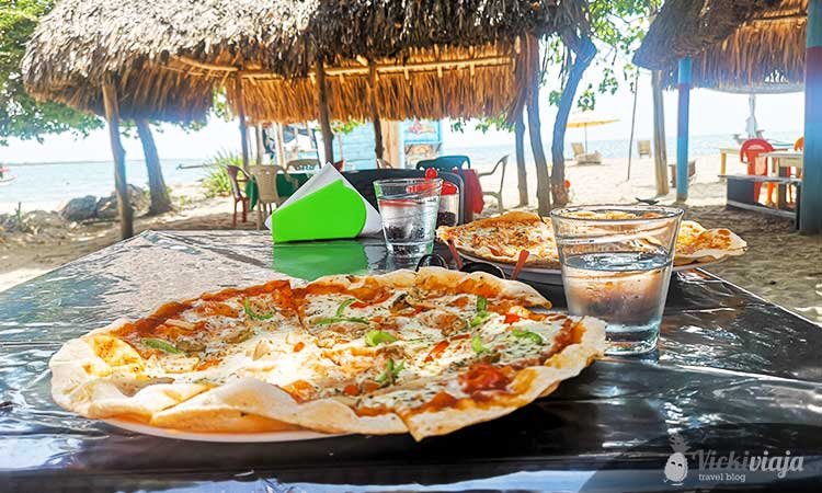 pizza in rincon del mar, vegetable pizza with beach in background