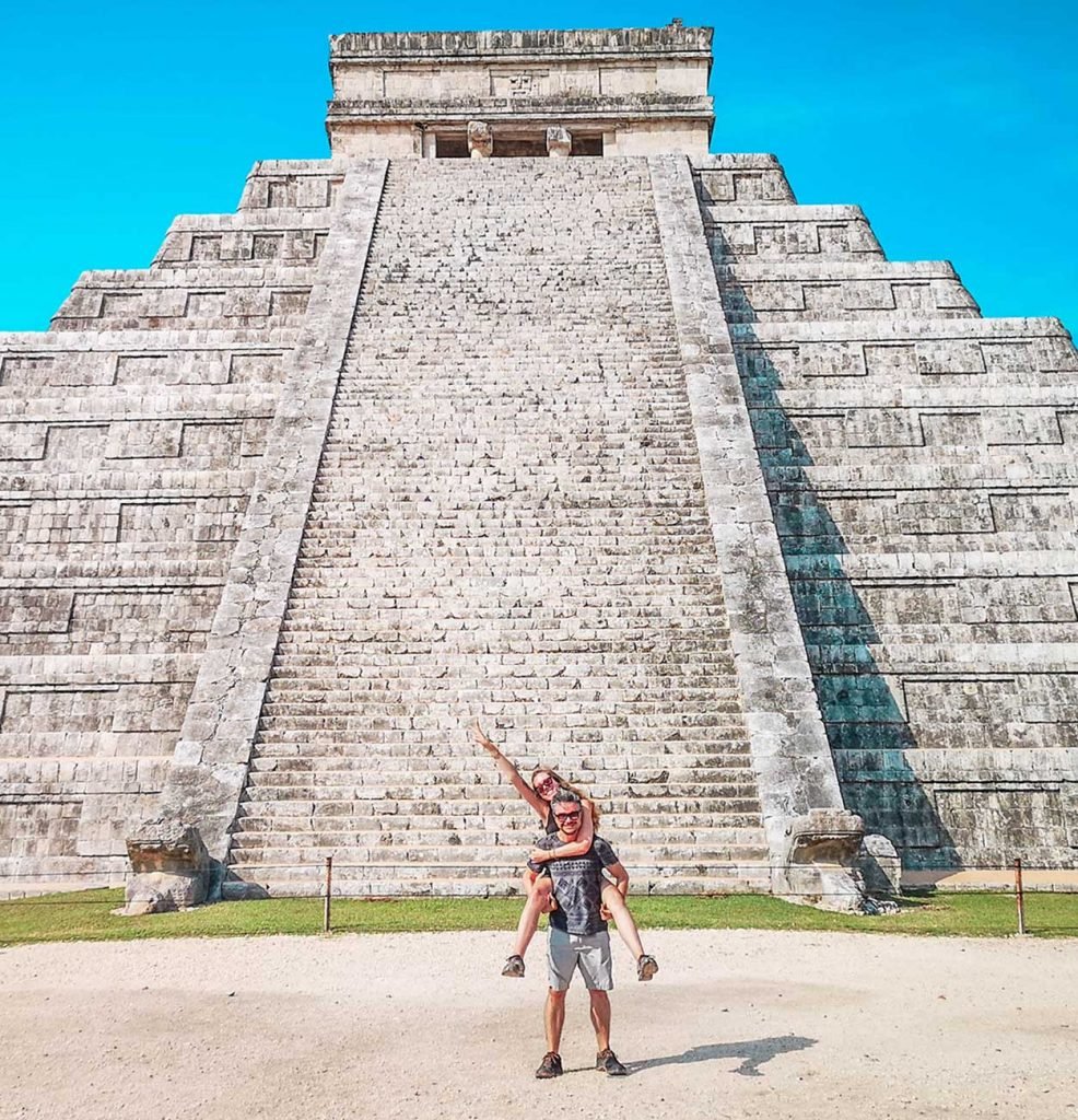 Vicki Franz and her husband Eduardo in front of the Chichen Itza pyramid in Mexico, travel blog